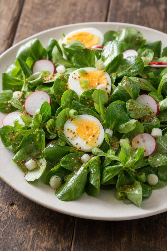 Lamb’s lettuce salad with egg, radishes and mustard dressing