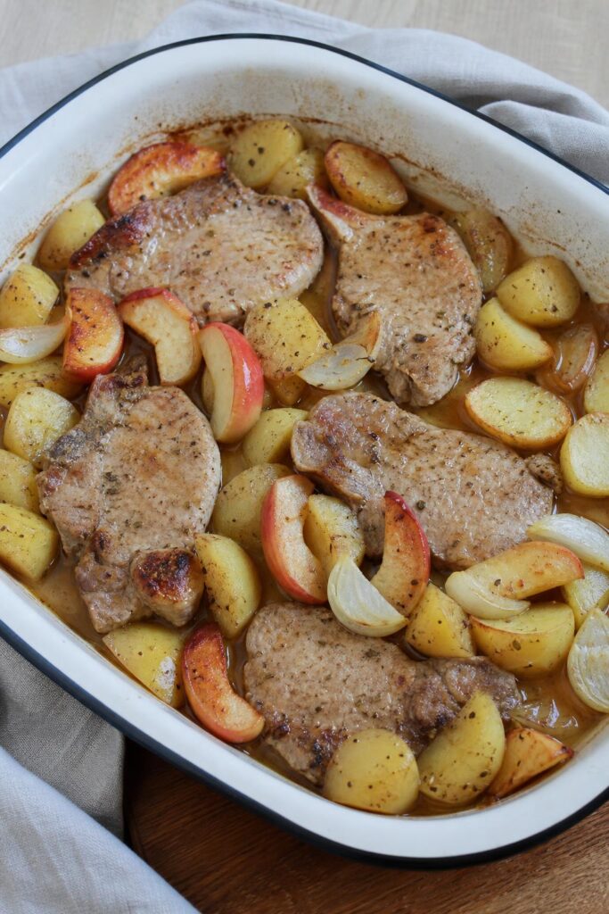 Pork slices with apples and onions from a single roasting pan